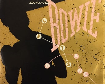 Disco de vinilo vintage de 7" de David Bowie: Let's Dance/Cat People, lanzamiento en EE. UU. en 1983