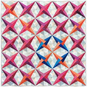 May include: A colorful quilt featuring a repeating star pattern. The stars are in shades of pink, orange, and purple, with a light blue and white background. The quilt is made of fabric and has a geometric design.