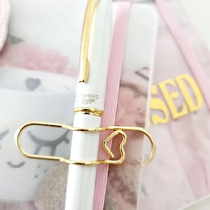 Hermoso portaplumas con clip en dorado, plateado y oro rosa. Perfecto para agendas y más: papelería, sujetapapeles.