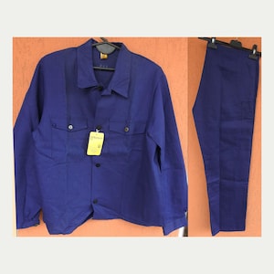 May include: A two-piece work uniform set in a deep blue hue. The long-sleeved button-up shirt features two chest pockets and a collar. Matching trousers are displayed alongside. A yellow tag hangs from the shirt.