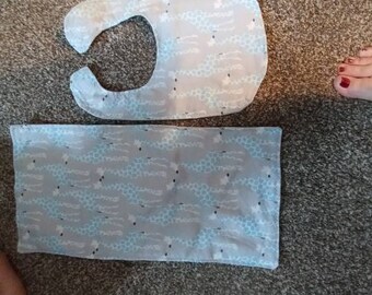 Blue giraffe and bib and burp cloth.