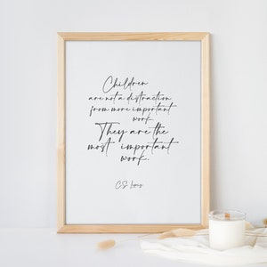 May include: A framed print with a quote by C.S. Lewis that reads "Children are not a distraction from more important work. They are the most important work."