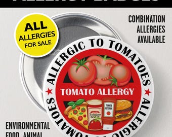 May include: A round pin-back button featuring a red and white design with the text ALLERGIC TO TOMATOES and TOMATO ALLERGY. The graphic includes illustrations of fresh tomatoes, a slice of pizza, a can of tomato soup, and a bottle of ketchup.