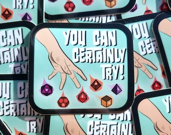 May include: A sticker with a cartoon hand reaching for a set of dice. The dice are various colors and have different numbers on them. The sticker has a teal background and black border. The text on the sticker reads "You Can Certainly Try!"
