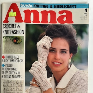 May include: April 1992 issue of "Anna" magazine featuring crochet and knit fashion. The cover shows a woman wearing a white crocheted jacket, gloves, and accessories. The magazine includes patterns for knitted lace, embroidery, and cross-stitch.