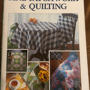 May include: A softcover book titled ONDORI FINE PATCHWORK & QUILTING featuring a cover collage of various quilted projects including a blue and white geometric tablecloth, a green and pink patterned quilt, and a multi-coloured pastel ruffled quilt.