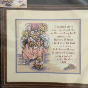 May include: A handmade wooden sign displaying the word "Welcome" in a whimsical font. The sign has a distressed white background and a dark stained wooden frame. Dimensions are roughly 30 cm wide and 15 cm tall.