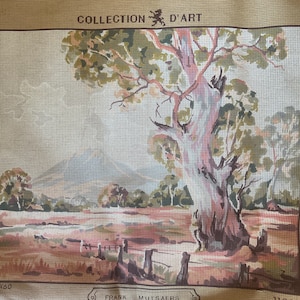May include: A needlepoint canvas featuring a landscape with a large tree in the foreground, a fence, and distant mountains. The text COLLECTION D'ART is printed at the top, and FRANK MUTSAERS is printed in a central bottom box with 11291 on the right.