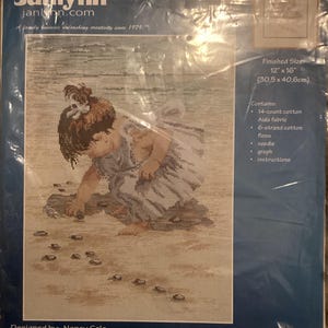 May include: Janlynn cross-stitch kit showing a child on a beach, designed by Nancy Cole. The finished size is 30.5cm x 40.6cm. Includes 14-count cotton Aida fabric, 6-strand cotton floss, needle, graph, and instructions. From a family business unleashing creativity since 1979.