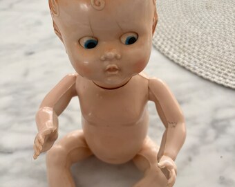 Vintage Pedigree New Zealand hard plastic baby doll, blinking eyes. Movable limbs