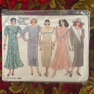 May include: A Vogue's Basic Design sewing pattern envelope, number 1846, featuring illustrations of five different dress styles. The designs include various necklines, sleeve lengths, and skirt silhouettes, all displayed on a white background.