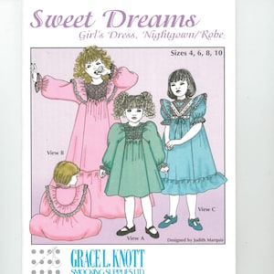 May include: A pattern for a girl's dress, nightgown, or robe, featuring illustrations of the garment in pink, green, and blue. The pattern includes sizes 4, 6, 8, and 10. The text "Sweet Dreams" is at the top, with the Grace L. Knott Smocking Supplies Ltd. logo.