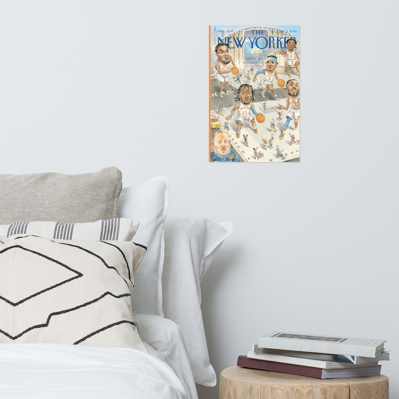 May include: A rectangular wall poster featuring a New Yorker magazine cover illustration. The artwork depicts a stylized basketball court scene with multiple caricatured players in white and blue uniforms, orange basketballs, and a crowd of tiny figures.