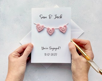 Engagement card with crochet hearts