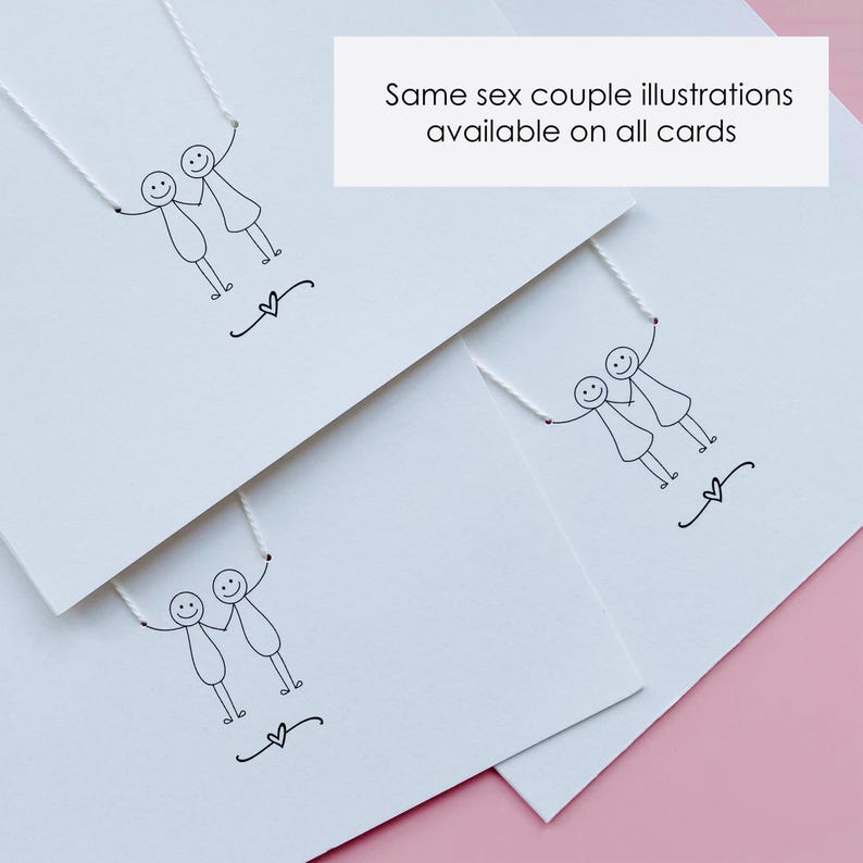 May include: White greeting cards with black line drawings of same-sex couples holding hands, with a heart symbol below. The text "Same sex couple illustrations available on all cards" is displayed on a white rectangle.