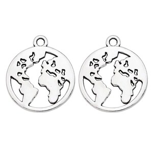 May include: Two silver-toned metal charms shaped like the Earth. Each charm has a detailed outline of the continents and a loop at the top for attaching to a necklace or bracelet.