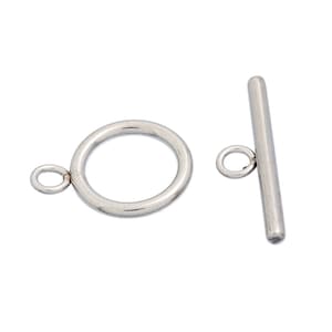 May include: Silver-toned metal toggle clasp with a round ring and a straight bar. The clasp is used for jewelry making.