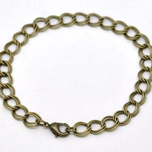 May include: A gold-toned chain bracelet with a lobster clasp closure.