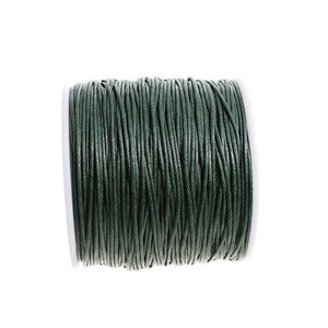 May include: A spool of dark green waxed cord, perfect for jewelry making, macrame, or crafts.