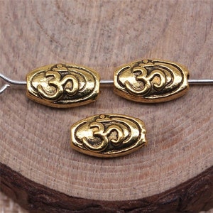 10 Gold OM Spacer, 10x5mm, Antique Gold Pin Beads (M-98)