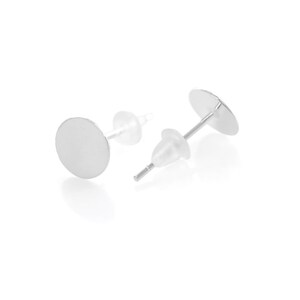 May include: A pair of silver earring posts with round, flat, silver tops. The posts are made of metal and have a clear plastic backing.