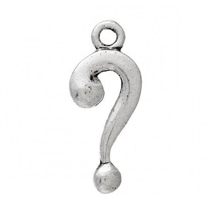 May include: A silver-colored metal charm in the shape of a question mark. The charm has a loop at the top for attaching to a chain or bracelet. The question mark has a rounded top, a curved body, and a small ball at the bottom.