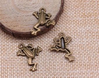 May include: Three bronze frog charms with a loop for attaching to jewelry or other crafts. The frogs are in a jumping pose.
