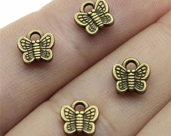 10 Tiny Bronze Butterfly Charms, 7mm, Antique Bronze Tone Charms (I-194)