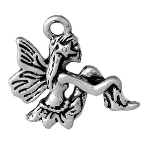 May include: Silver charm featuring a fairy with wings, sitting with her legs crossed. The fairy has a star on her head and is wearing a skirt.