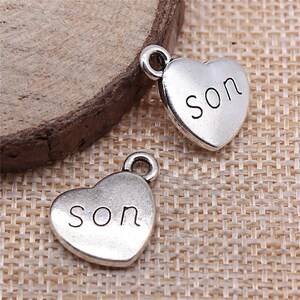 4 Silver Son Heart Charms, Silver Tone Charms (B-40)