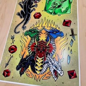 May include: A colorful illustration of four dragons, each with a different color, surrounded by flames. The dragons are facing outward, with their heads and necks extended. There are also several red gems and a black panther in the image.