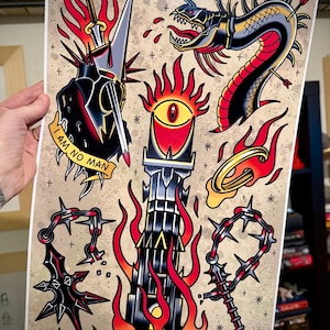 May include: A traditional tattoo flash sheet with a black and red dragon, a tower with a flaming eye, a sword, a chain with spikes, and the text "I am no man".