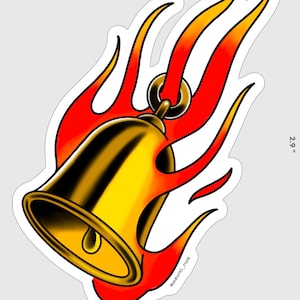 May include: A gold bell with a red and yellow flame design. The bell is 2.2 inches wide and 2.9 inches tall. The image includes the text "@samurai_rusk".