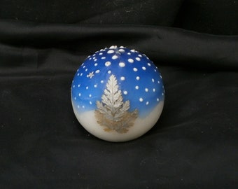 Vela con paisaje navideño