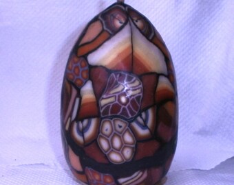 Vela ovoide envolvente