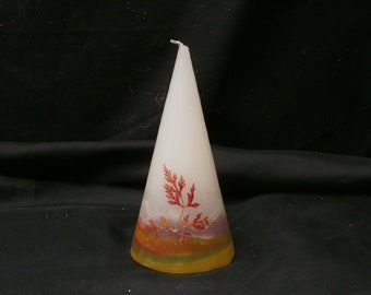 Vela con paisaje otoñal