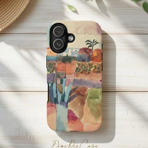 May include: A white ceramic mug with a black handle and the text "But First, Coffee" in a black, bold font. The mug is sitting on a wooden surface. The mug is approximately 4 inches tall.