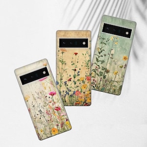 Può includere: Tre custodie per telefono con motivi floreali. Le custodie sono tutte di colori diversi e hanno diversi motivi floreali. Le custodie sono tutte realizzate in materiale plastico rigido.