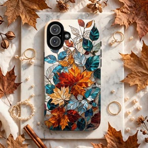May include: A rectangular smartphone case featuring a stained-glass style design of overlapping autumn leaves in shades of orange, yellow, red, and teal. The case has a black camera module cutout at the top left corner and a glossy finish.