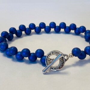 Playful Bracelet made of Czech Glass Beads in a Lovely Brilliant Blue with Opalescent Finish & Luxurious Feel. Finished w/ a Simple Toggle!