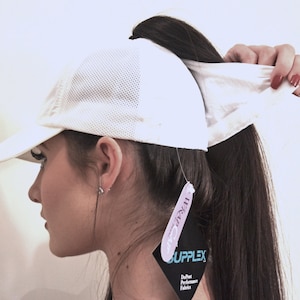 Sports baseball cap has a high opening for a ponytail without the need for barrettes or holder