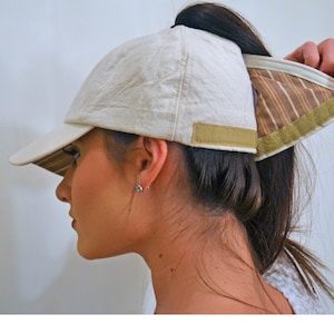 Womens baseball cap in Beige cotton quilted material has a high opening for a ponytail without the need for barrettes or holder