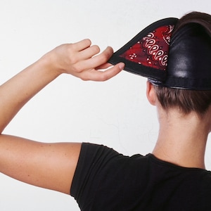 Black Leather baseball cap has a high opening for a ponytail without the need for barrettes or holder.