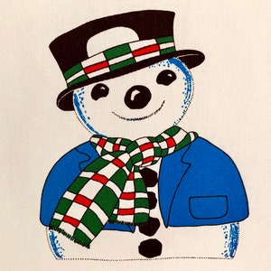 May include: A snowman wearing a blue jacket, a green and red plaid scarf, and a black top hat with a green and red plaid band.