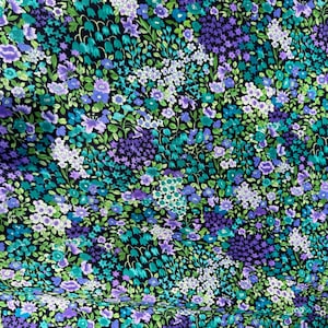May include: A fabric with a dense floral pattern. The design features a variety of flowers in shades of purple, blue, green, and white against a black background. The flowers are of different sizes and shapes, creating a textured look.