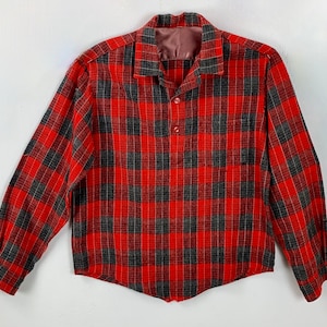 May include: A red and black plaid flannel shirt with long sleeves and a button-up front.