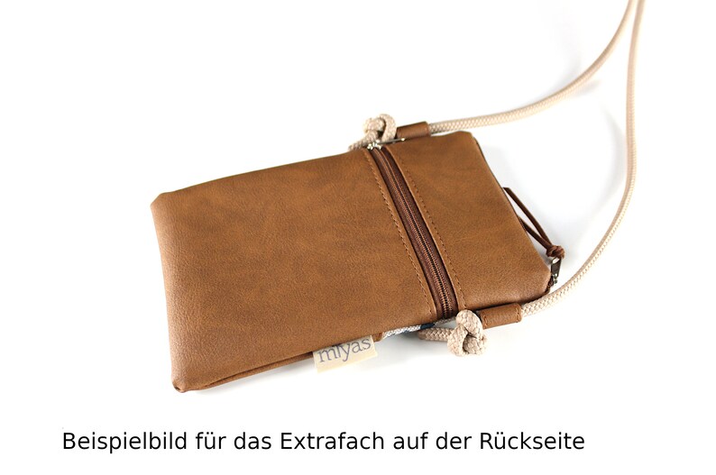 May include: A brown faux leather phone pouch with a zipper closure and a beige rope strap. The pouch has a small label that says "miyas" on the front. The image shows the back of the pouch with an extra pocket.