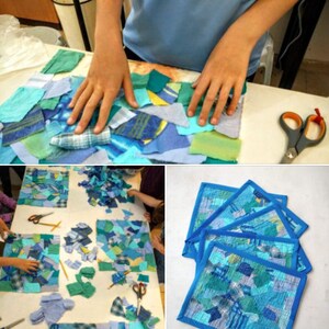 May include: A collage of blue and green fabric scraps being assembled on a white surface. The image shows hands arranging the pieces, scissors, and finished squares with blue borders. The project appears to be a textile craft or art piece.