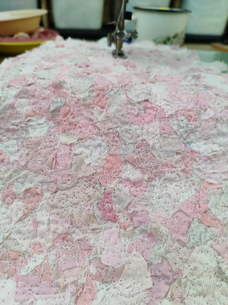 Pink scrapfabric made from many small pieces of fabricscraps