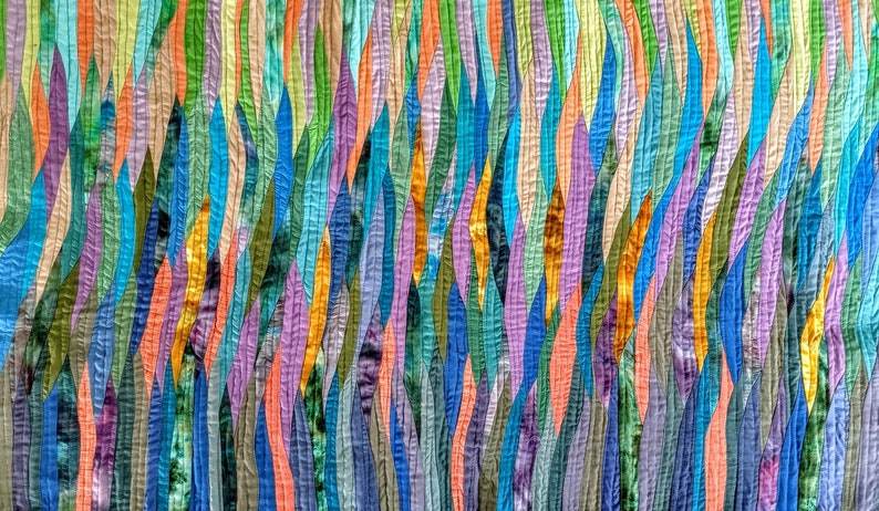 May include: A colorful abstract quilt with a pattern of vertical, wavy lines in shades of blue, green, purple, orange, and yellow.